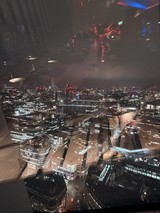 Reflective Night View Over London's Illuminated Cityscape