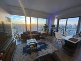 Sunset View from a Chic Penthouse Living Room