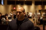 Bald Man in Blue Shirt