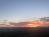 Train Silhouetted by a Vibrant Desert Sunset