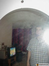 Reflection of a Man in an Urban Room