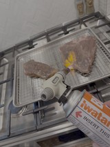 Kitchen Torch Caramelizing Raw Fish Steaks