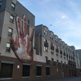 Hand Mural with Airplane