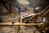 Historical Mining Diorama with Wooden Cart and Workers