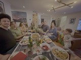 Family Thanksgiving Dinner Gathering Around Table