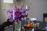 Purple Blooms in a Stoneware Vase