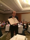 Man Giving a Speech at a Conference