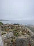A Breathtaking View of the Turquoise Ocean from the Rocky Cliff