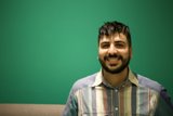 A Happy Man with a Beard and Striped Shirt