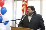 Man with Long Hair and Beard Delivering a Speech