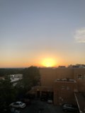 Sunset over a Parking Lot with 7 Cars