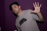 Grey-Shirted Man Rocks a Baseball Cap