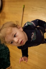 Child Lying on Wooden Floor - Christmas Morning Portrait