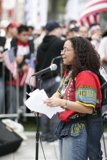 Woman with a Microphone Leading the Student Protest