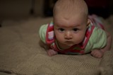 Determined Baby During Tummy Time on Carpet