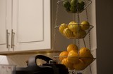 Three-Tier Hanging Fruit Basket in Modern Kitchen