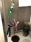 Elf Dolls Perched on a Coffee Maker