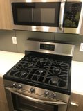 Sleek Stainless Steel Stove and Microwave Set