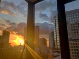 Urban Sunset Through a Window