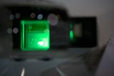 Green Light Shining Through Glass Window