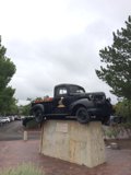 Lone Pickup Truck on Concrete Block