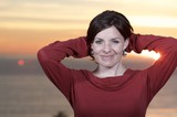 Woman in Red at Golden Sunset by the Sea