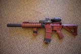 Red Firearm Ready to Strike