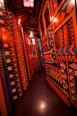 Vibrant Geometric Corridor with Bold Orange Patterns