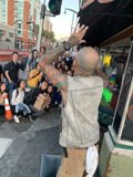 Tattooed man poses with group in San Francisco
