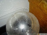 Silver Disco Ball Shining on the Floor