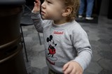 Young Child in Mickey Mouse Sweatshirt at Disneyland