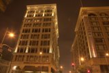 Illuminated Skyscraper in the Busy City