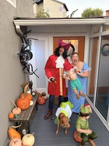 Peter Pan Family Halloween Costume on Decorated Porch