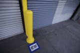 Yellow Pole with City Sign