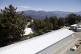 White Roof Building and Trees