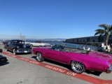 Pink Convertible and Boat at the Waterfront