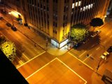 Aerial View of Bustling City Streets at Night