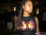 Young Woman with Braids in Black Shirt