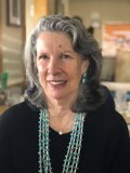The Lady with the Gray Hair and Bead Necklace