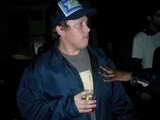 Cameron W Sports a Blue Jacket and Baseball Cap