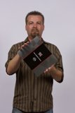Red and Black Folder in Hand