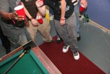 Black Shoes on Billiard Table