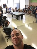 FFW Office All Hands Meeting Selfie Pool Table Employees Gathered Tech Startup Interior Modern Open Floor Plan Smiling