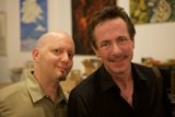 Two Men Clad in Dress Shirts Strike a Pose in Art Walk