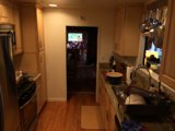 Modern Kitchen with Hardwood Flooring and Stainless Steel Appliances