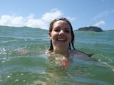 Smiling Woman Swimming in Hawaiian Ocean Waters