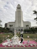A Chic Wedding Cake Displayed in the Heart of the City