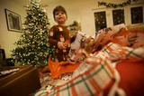 Christmas Morning Joy: Child Opening Presents
