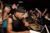 Nightclub Entertainer in Black Tank Top and Baseball Cap