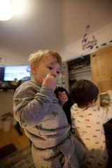 Young Children in Pajamas at Home in Kitchen